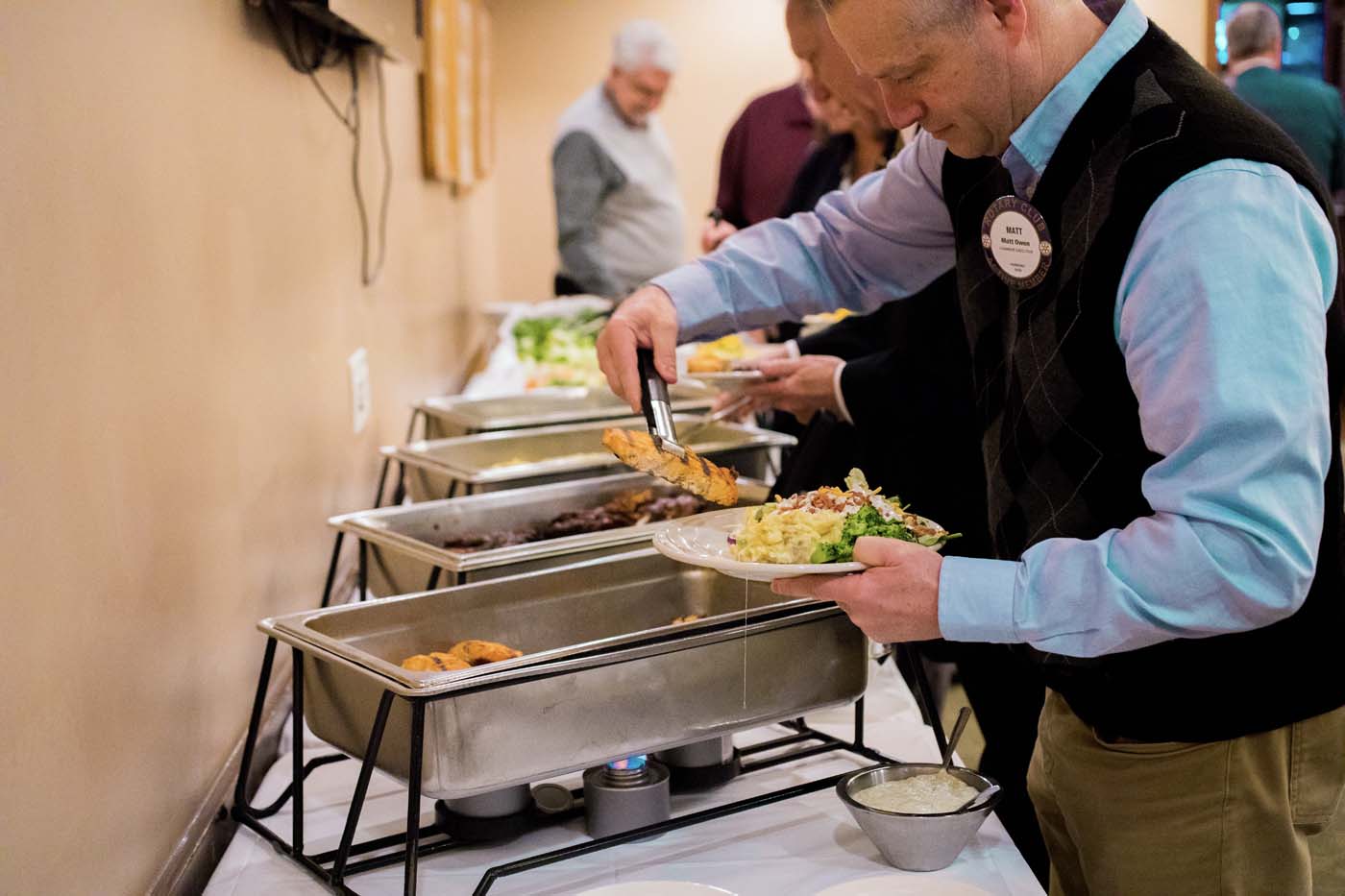 Customer partaking in the TJ Chumps catering service